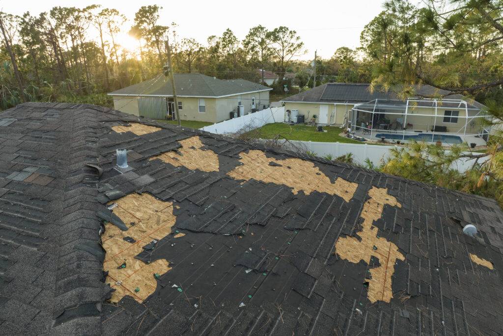 damaged house roof with missing shingles after hur 2023 11 27 05 09 59 utc