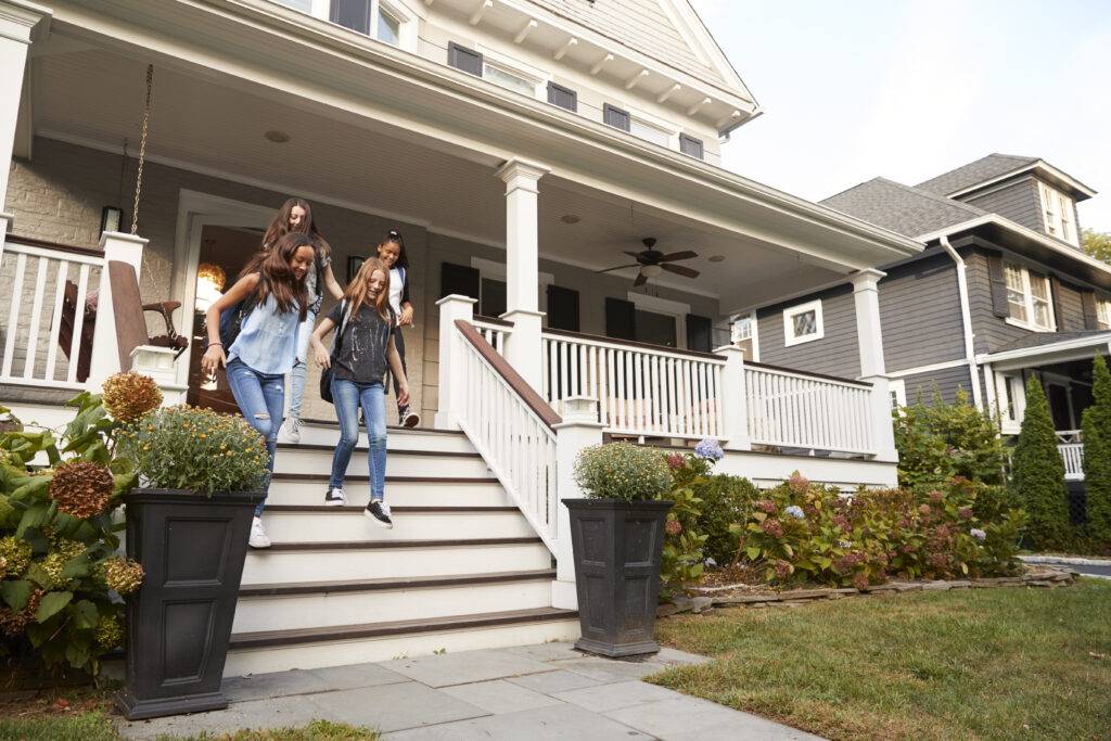 four teen girlfriends walking down front steps of 2023 11 27 05 00 11 utc