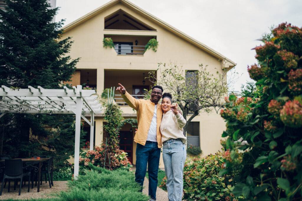 multiracial couple holding keys and standing outsi 2023 11 27 05 27 52 utc