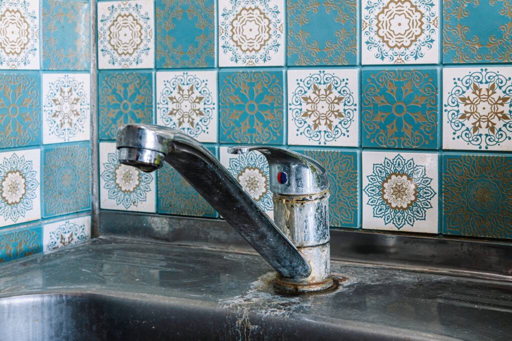 old rusty sink faucet in kitchen rust streaks ca 2023 11 27 04 54 04 utc