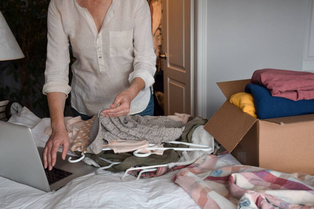 woman preparing clothes to resale online 2023 11 27 05 34 38 utc